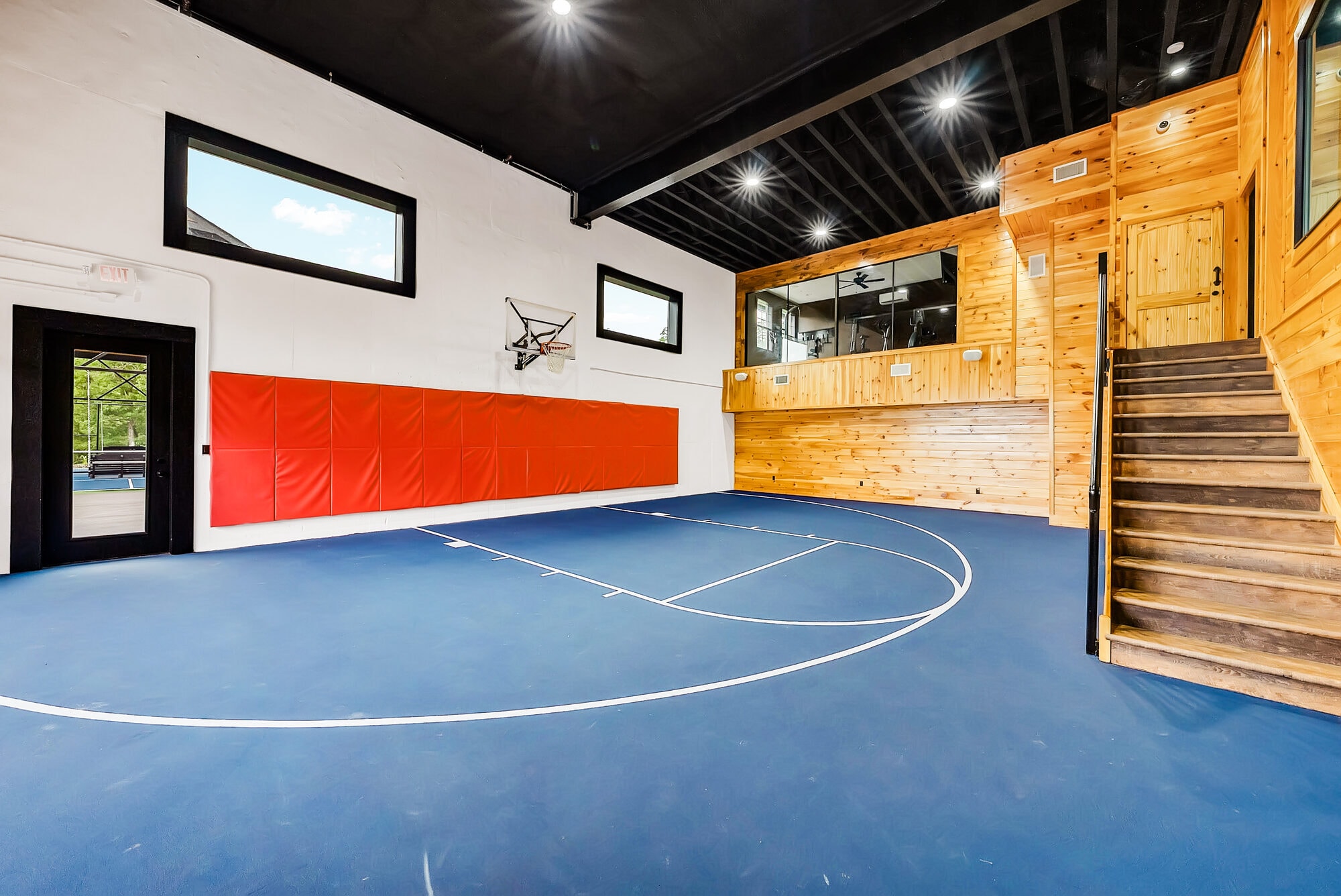 Excalibur indoor basketball court opposite angle gym mezzanine staircase