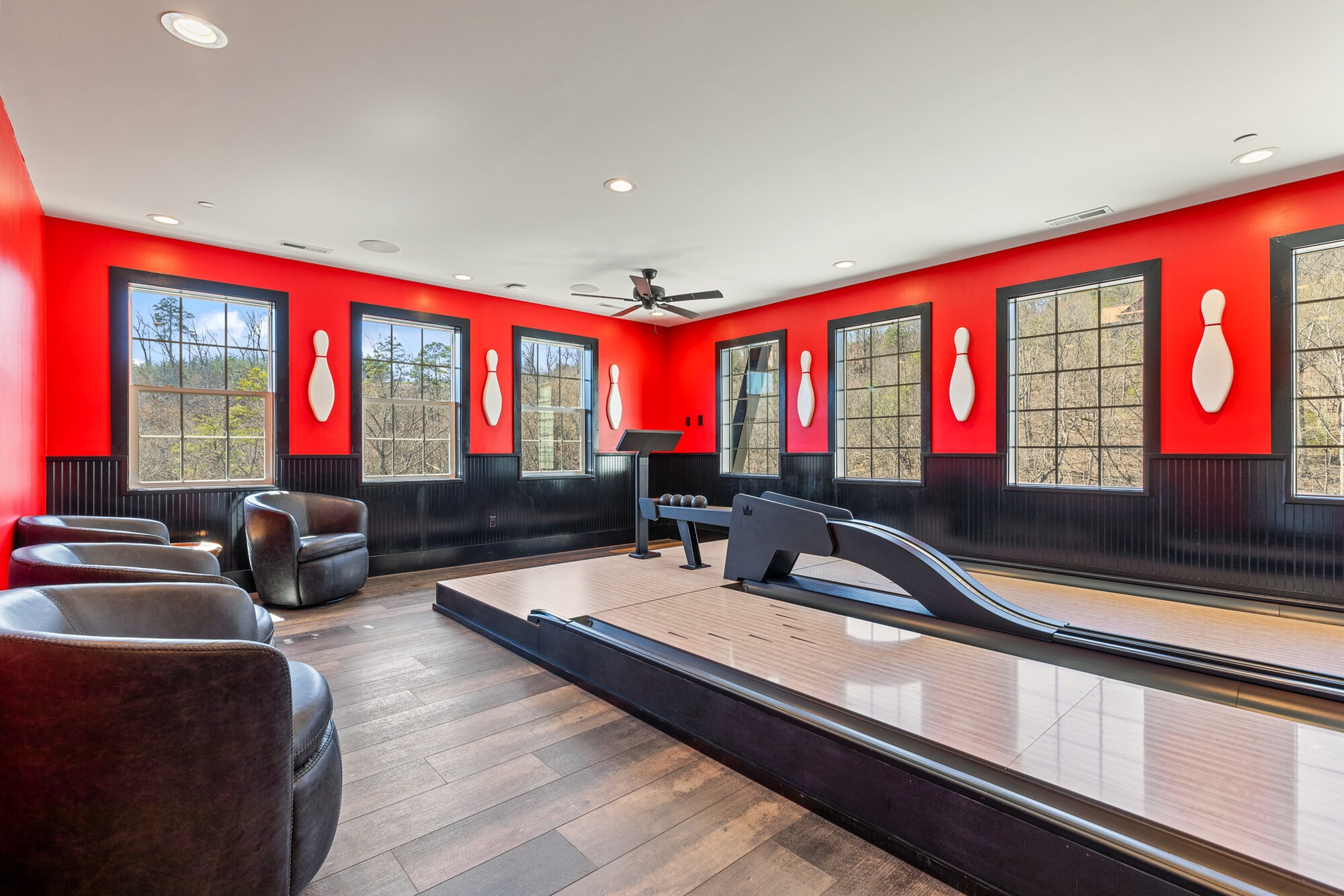 Excalibur private two-lane duckpin bowling alley with red walls, luxury lodge