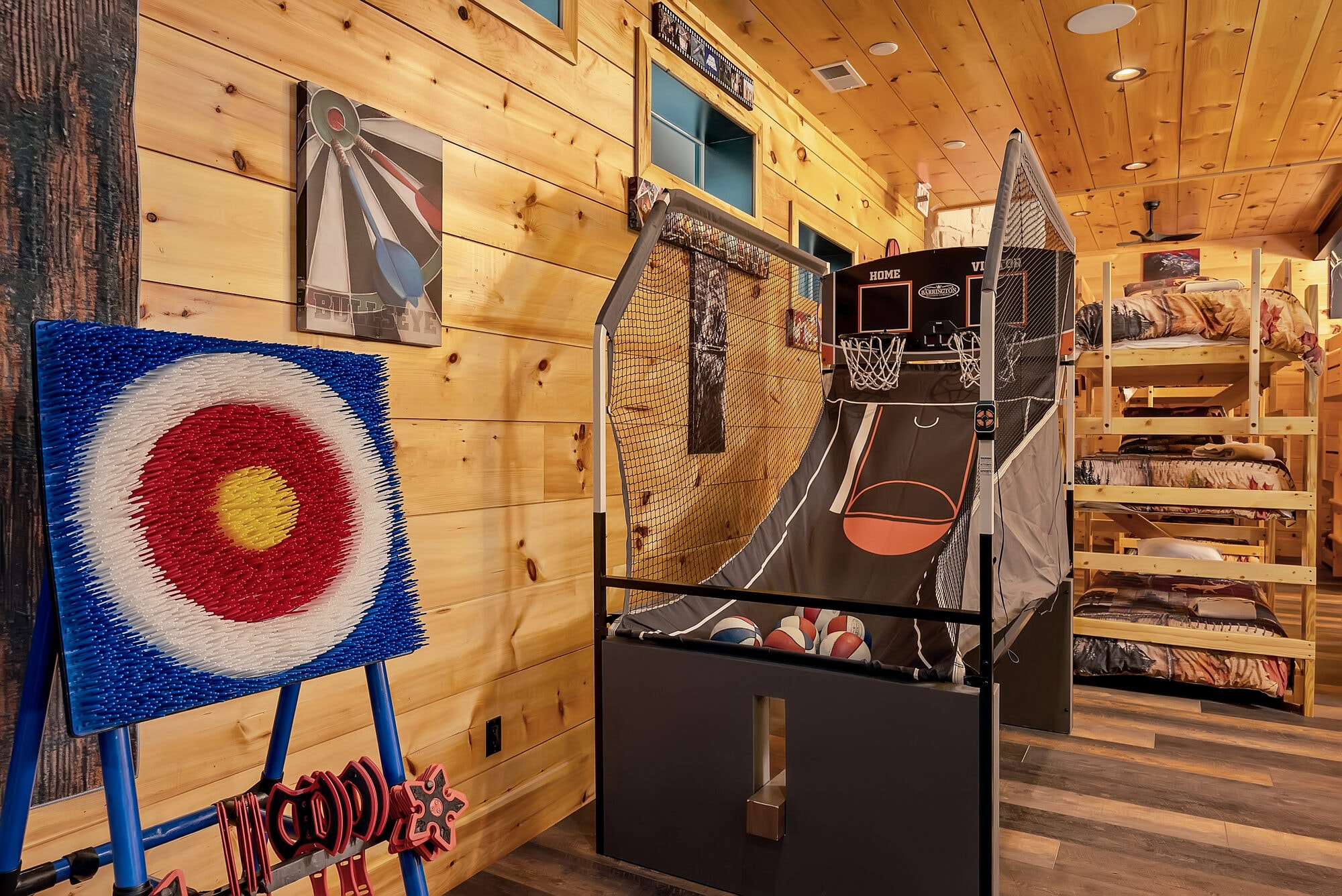 Excalibur game room full overview Pac-Man wall pool table bunk room animal mounts