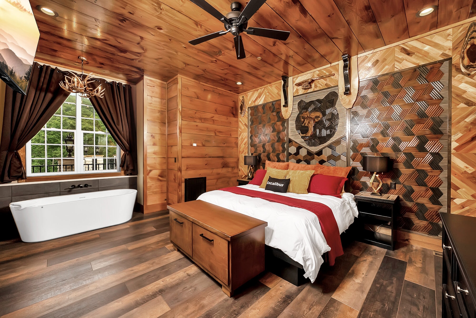 Luxury log cabin bedroom with ensuite soaking tub