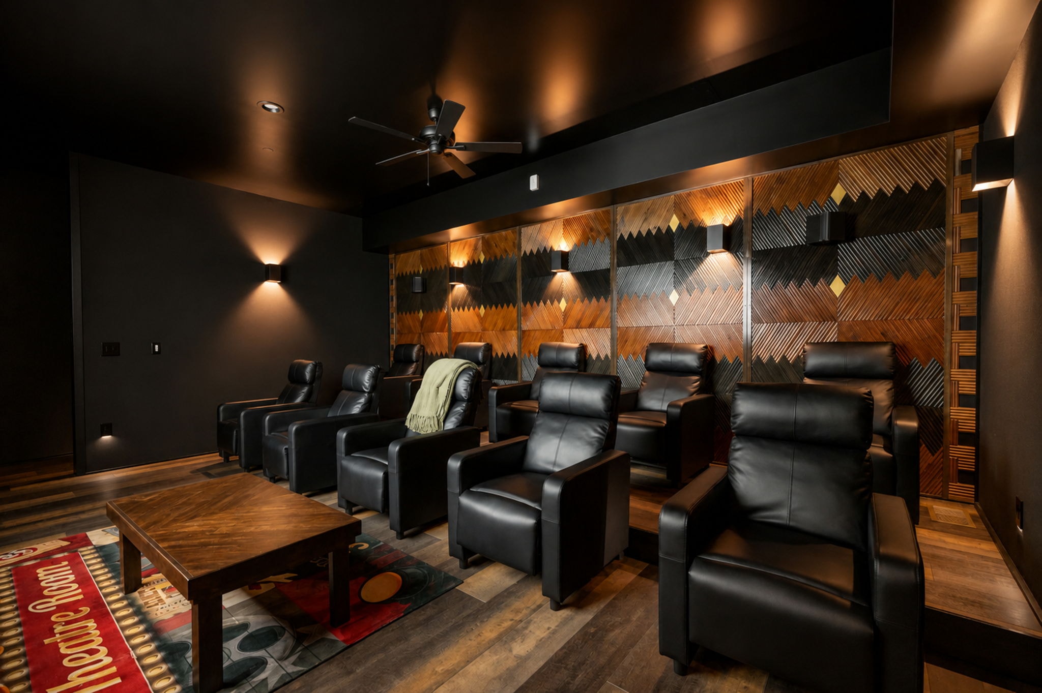 Excalibur soundproof private theater room with leather recliners and 100-inch screen