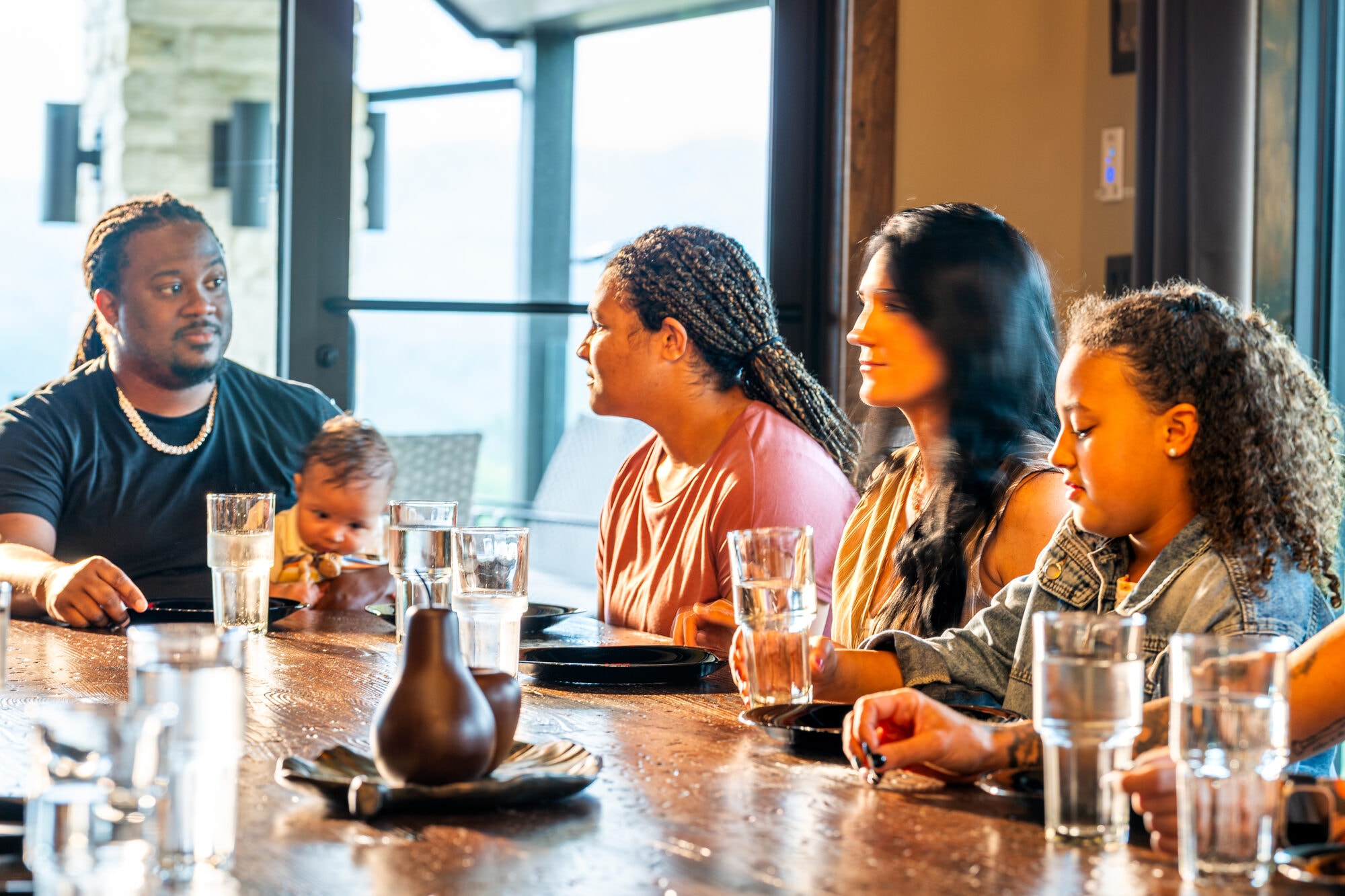 Corporate group dining together at Excalibur Lodge mountain view windows